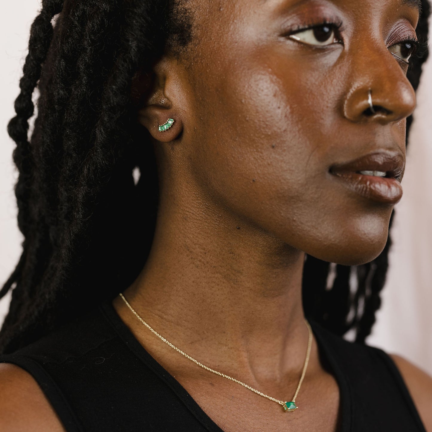 Baguette arc studs on a model