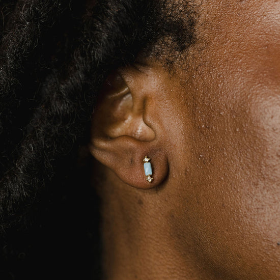 Jane earrings in light blue on a model