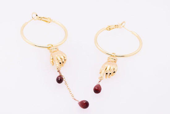 Gold hoops on white background