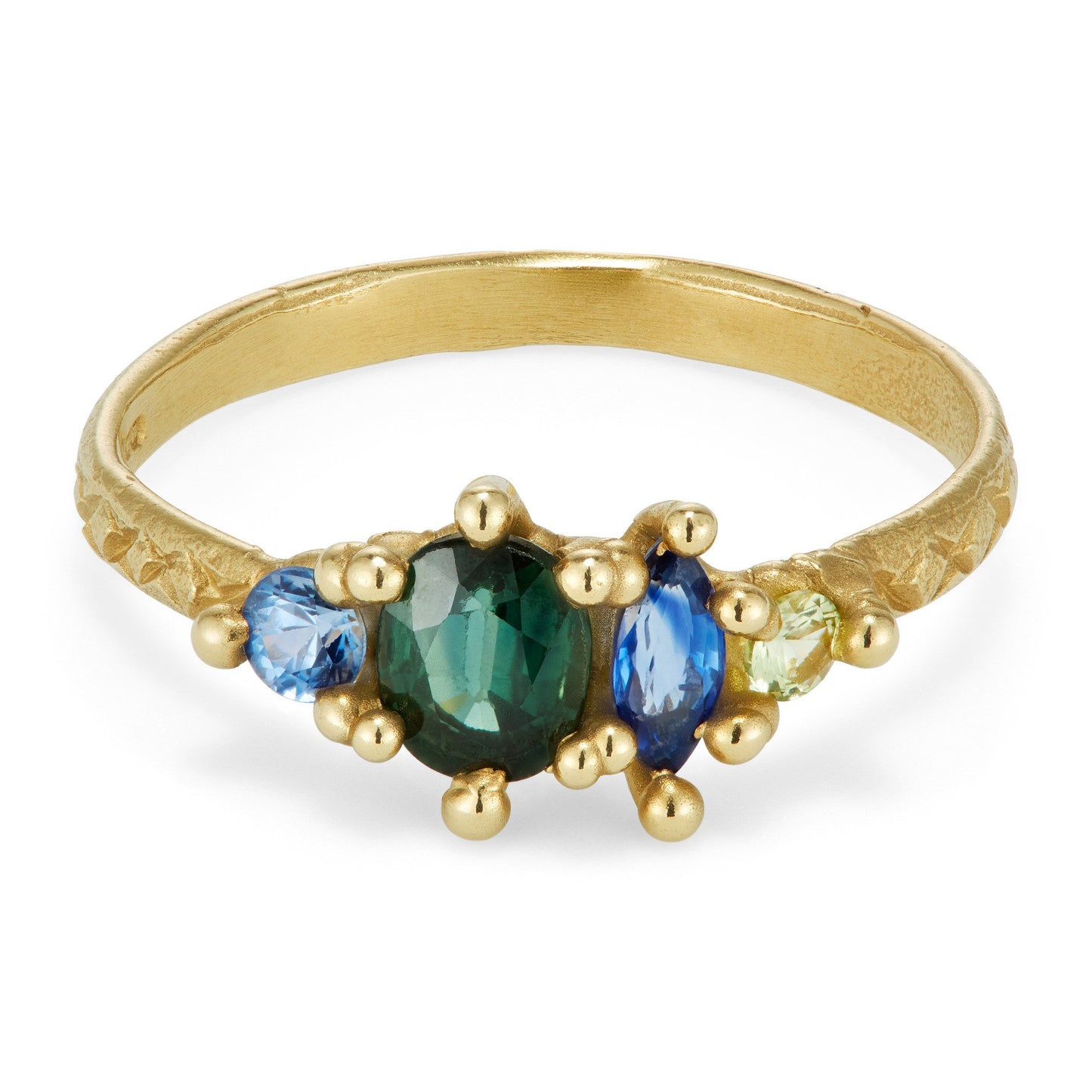 yellow gold cluster ring with varying shaped and colored green and blue sapphires on white background