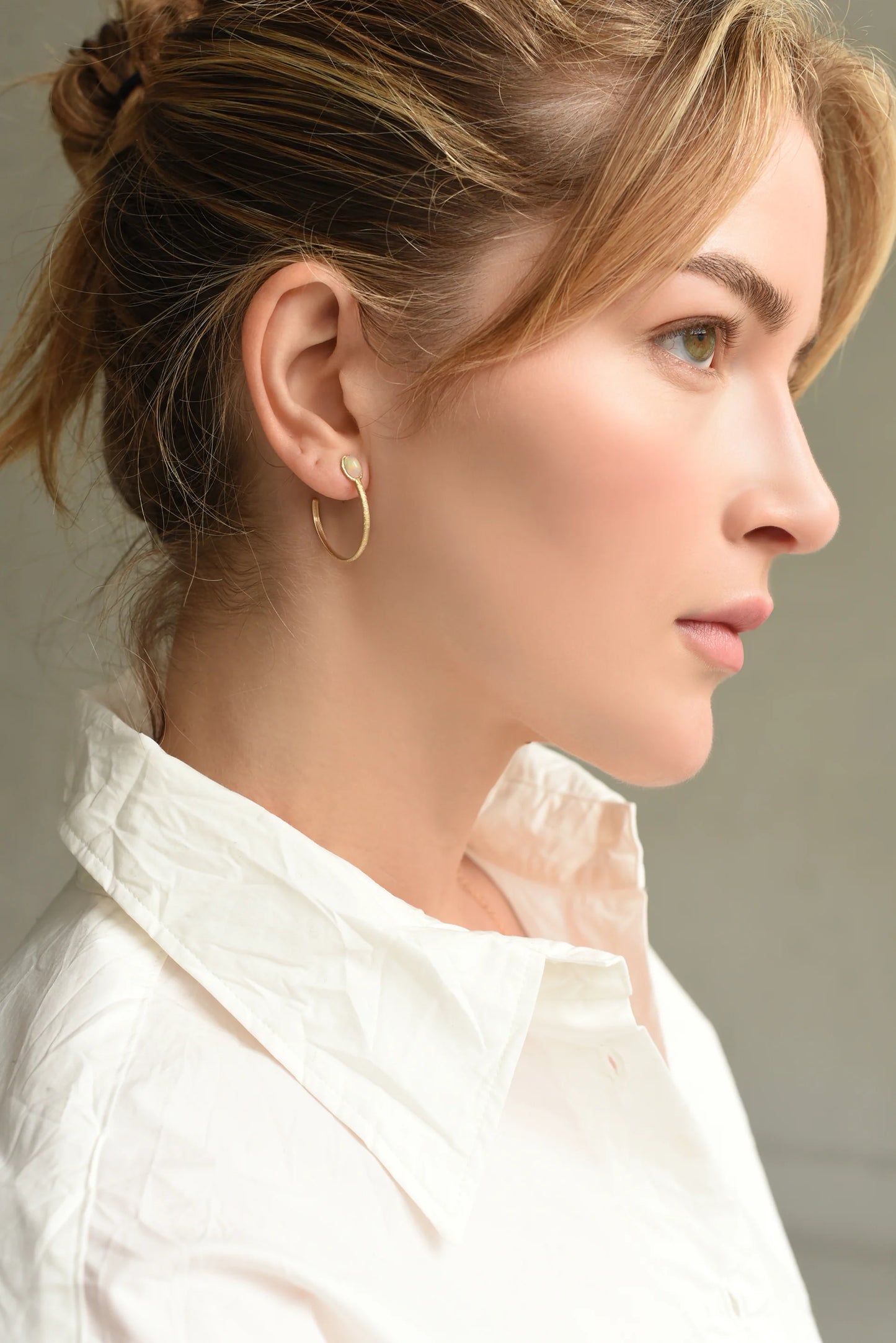 model wearing the opal hoop earrings