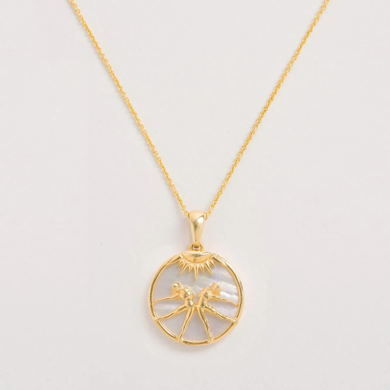 Gemini Necklace on an off white background