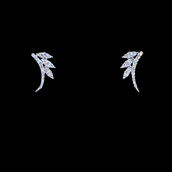 white gold stud earrings in the shape of an arc with three marquise shaped leaves coming off the side on a white background
