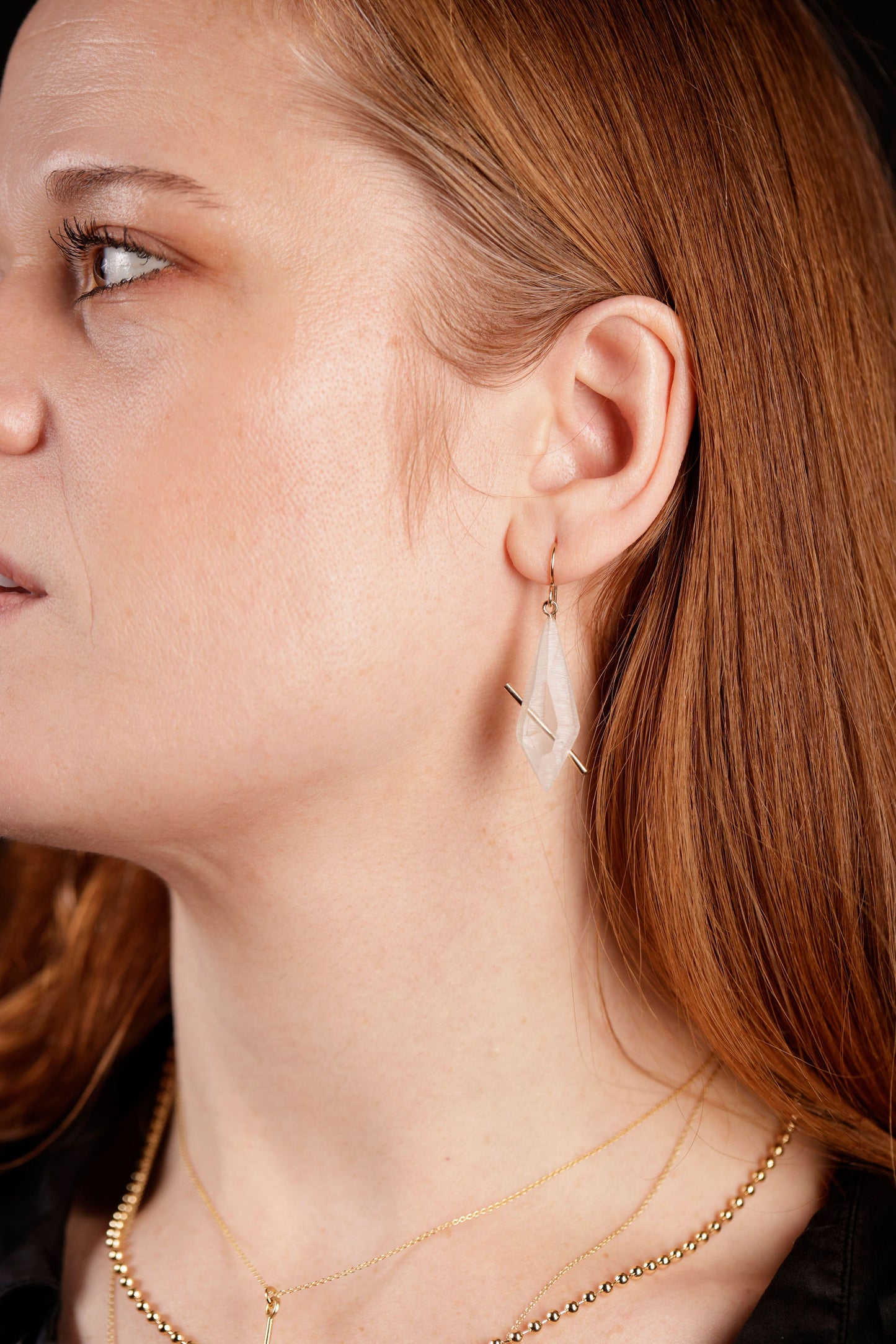 Lucid crystal earrings on model