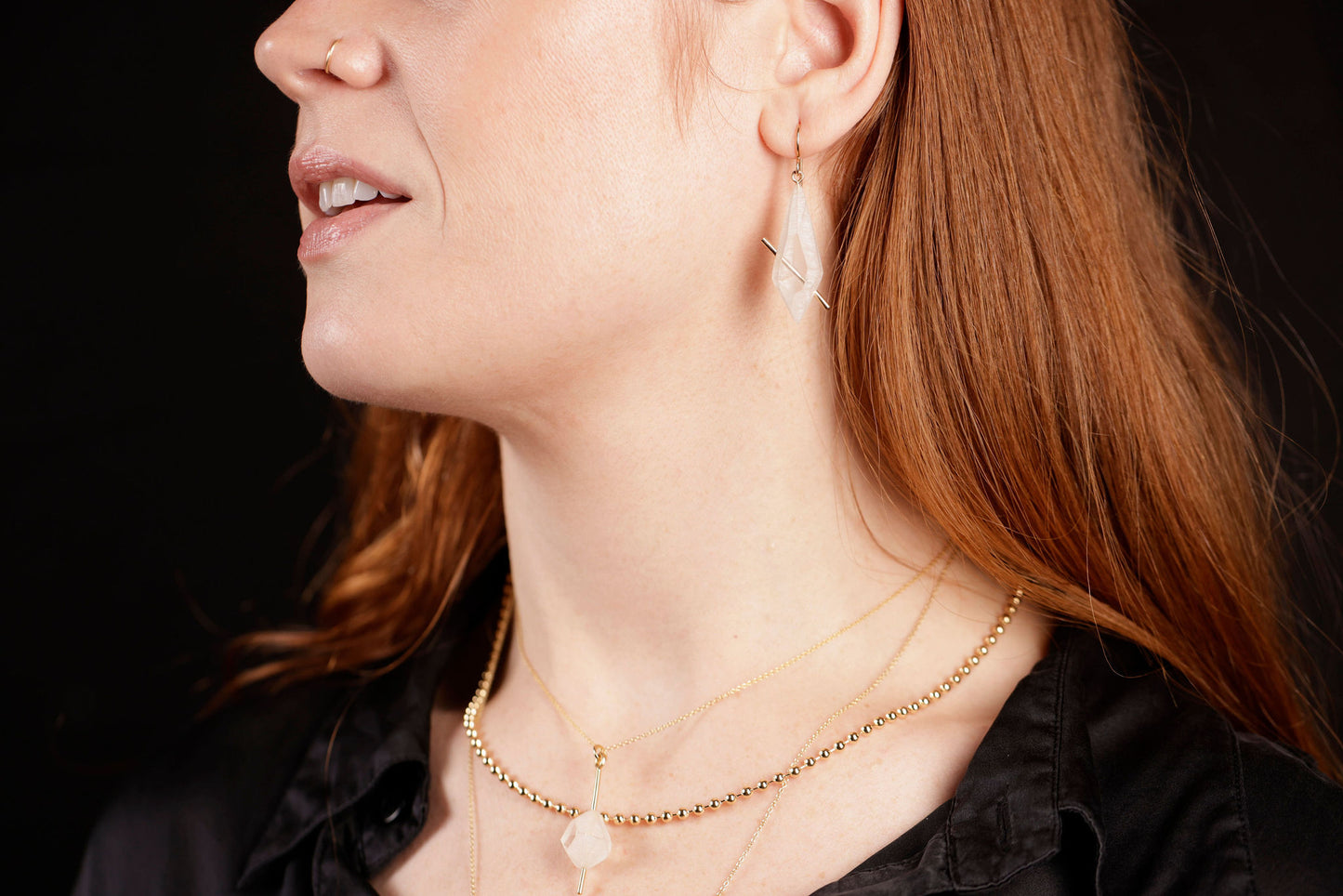 Lucid crystal earrings on model