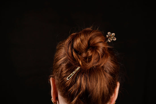 orchid hair pin on model