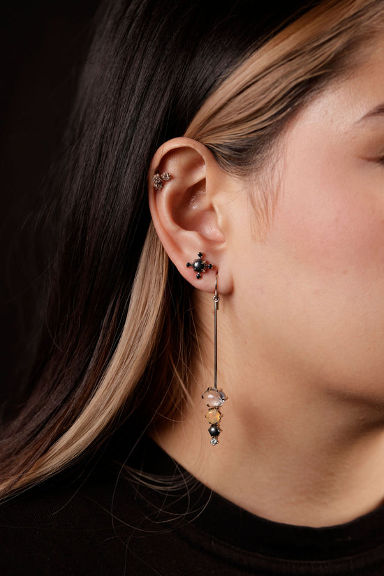 gem spike earrings on model