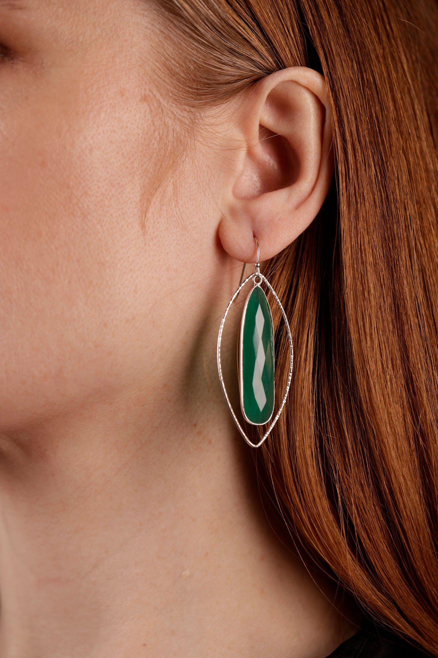 green onyx petal earrings on model