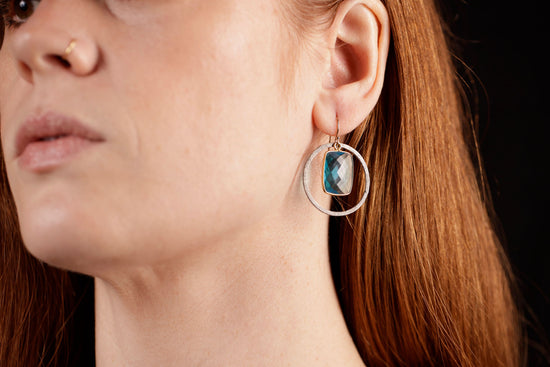 topaz circle earrings on model