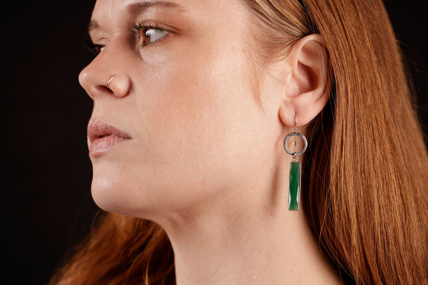 Green onyx dangle earring on model