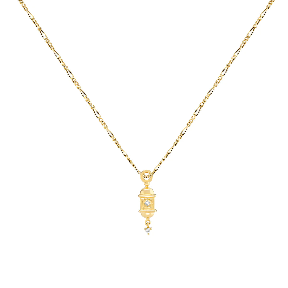 a gold lantern shaped pendant with white diamonds accents on a figaro chain on a white background