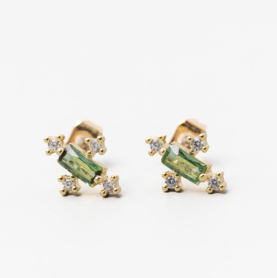 Load image into Gallery viewer, green tourmaline baguette shaped gemstone stud earrings with a round cubic zirconia on each side, angled on a white background
