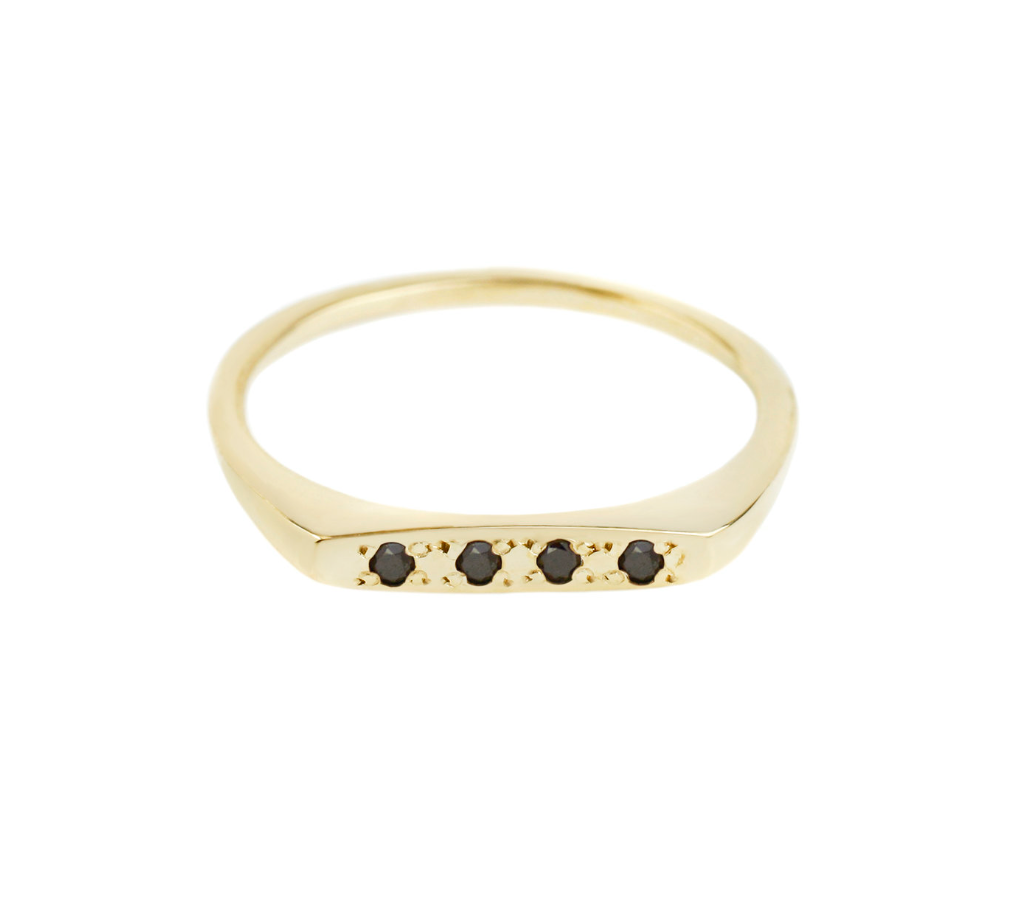 yellow gold bar signet ring with four black diamonds on a white background