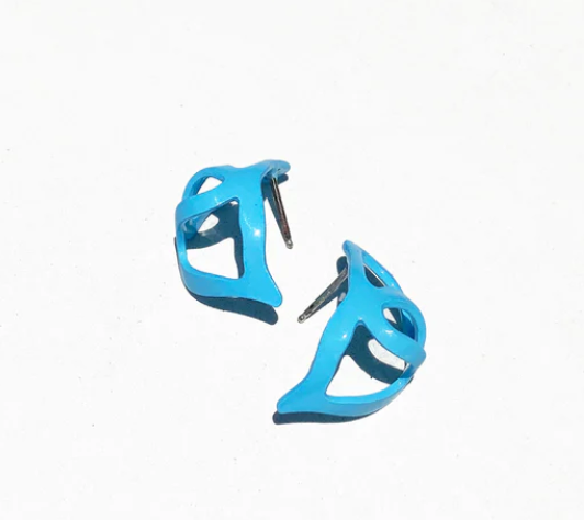 blue swirled huggie earrings on a white background