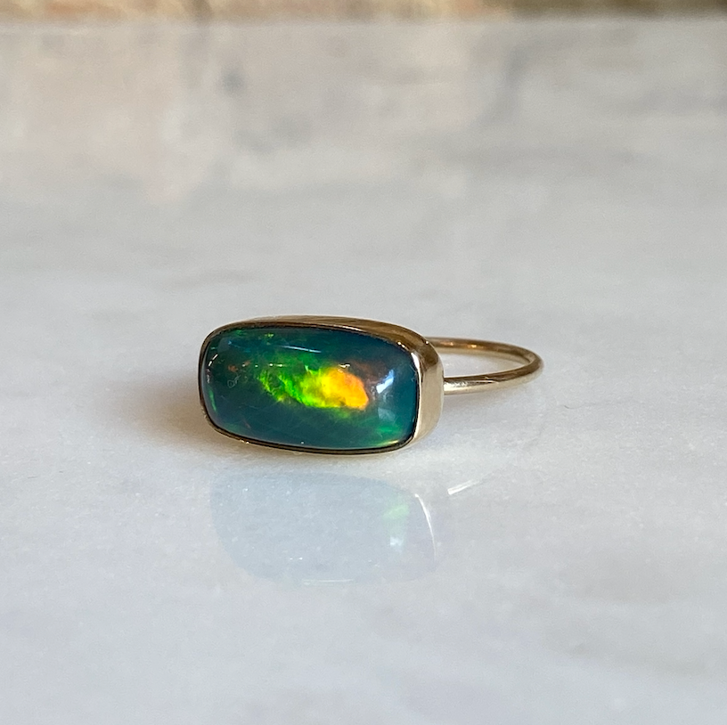 dark opal ring on marble