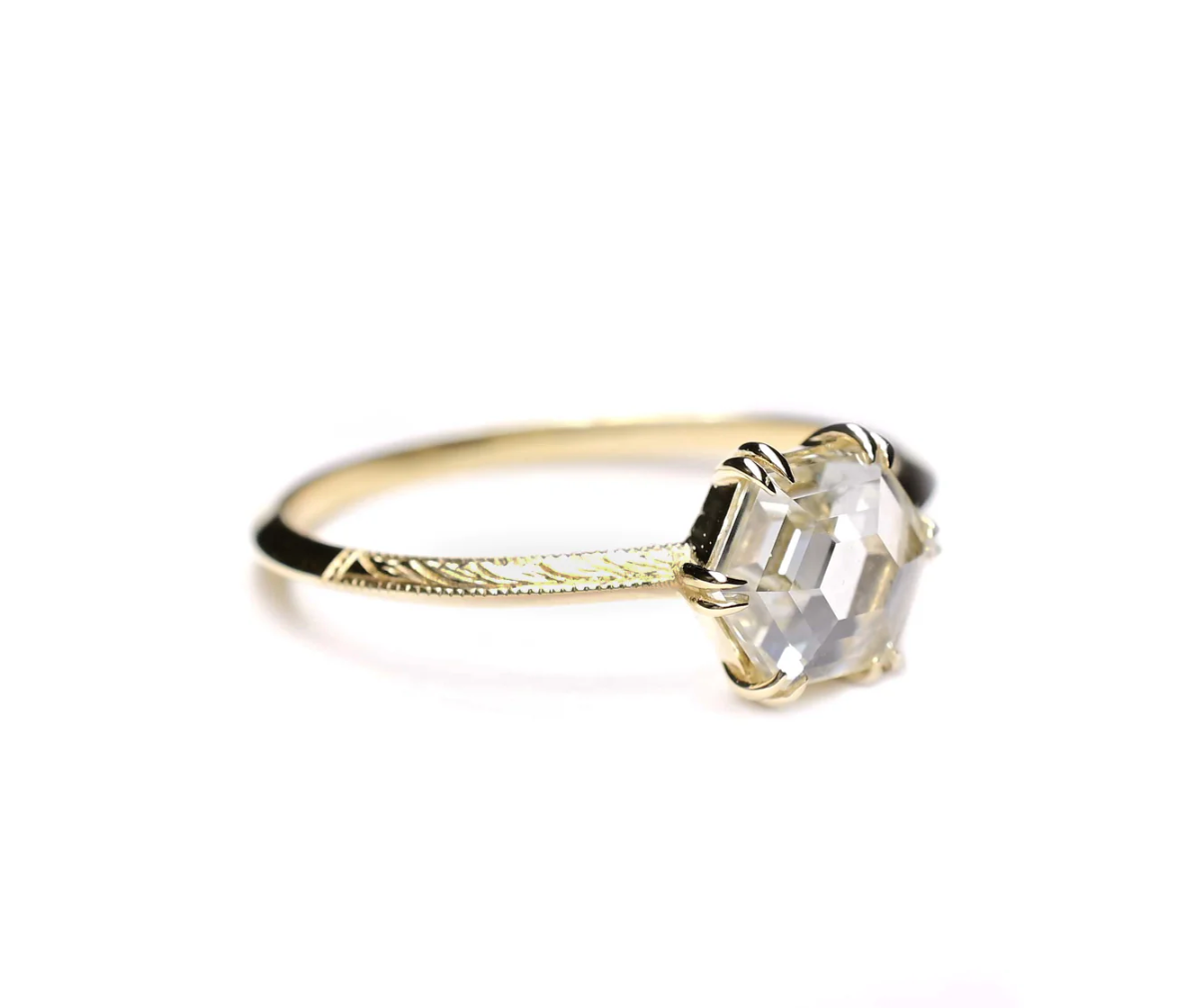 Load image into Gallery viewer, angled view of the hexagon rose cut diamond solitaire ring with engraved details on it&amp;#39;s knife edge band, sitting on a white background
