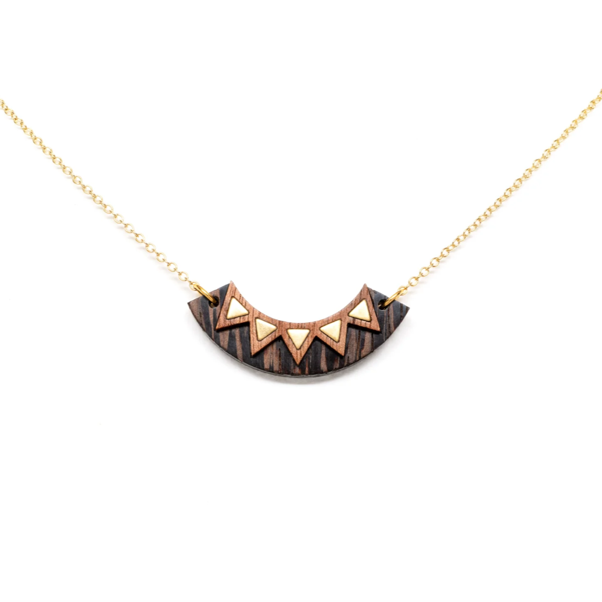 Load image into Gallery viewer, a two tone wooden arc necklace with brass triangle details and a gold plated brass chain spread out on a white background
