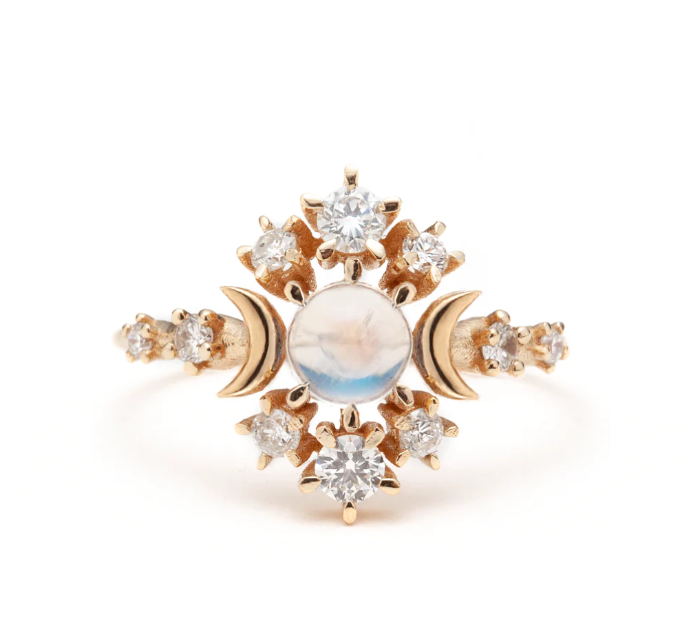 Load image into Gallery viewer, a yellow gold ring with a rainbow moonstone center, diamond accents and gold moon details on a white background

