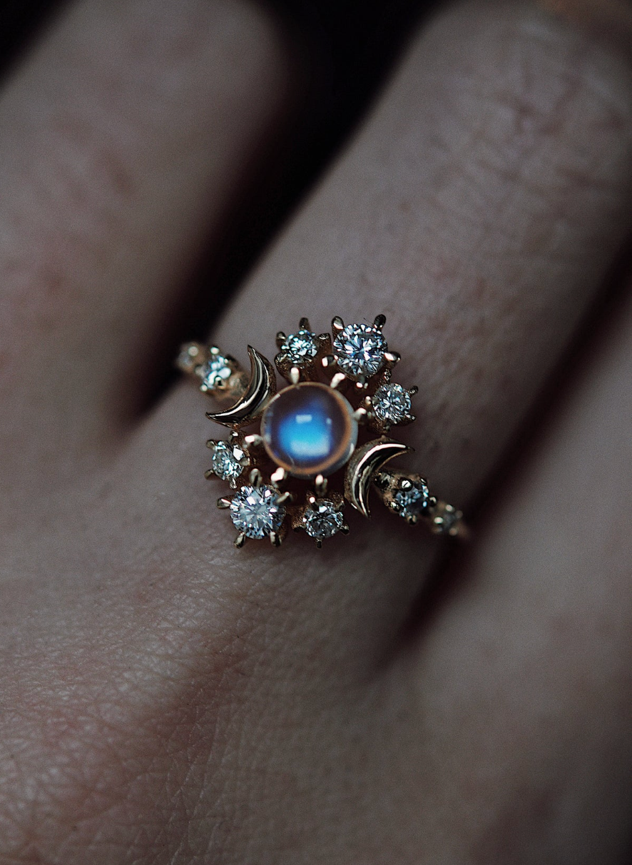 close up of a model wearing the moonstone wandering cosmos ring