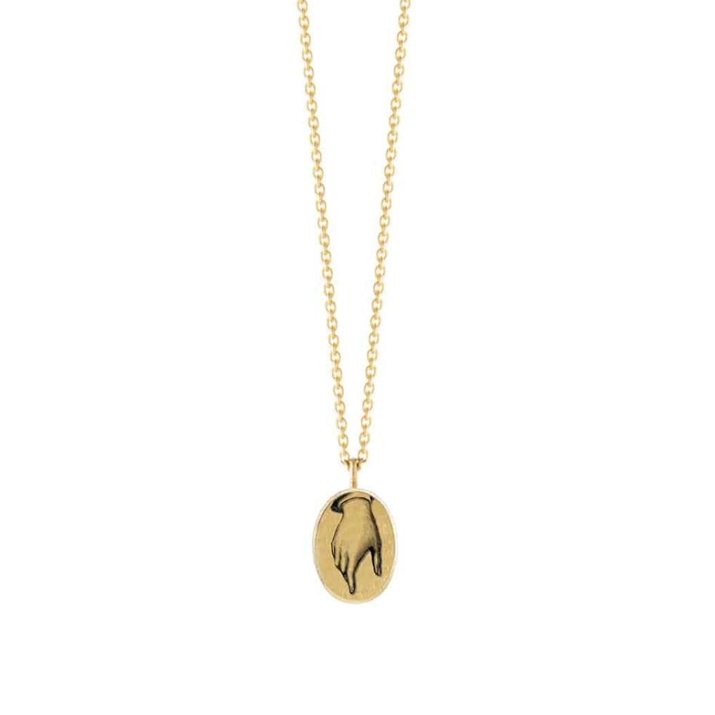 gold oval pendant necklace with a hand drawn hand motif on a white background
