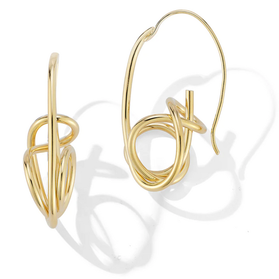 gold coiled brass wire earrings on a white background