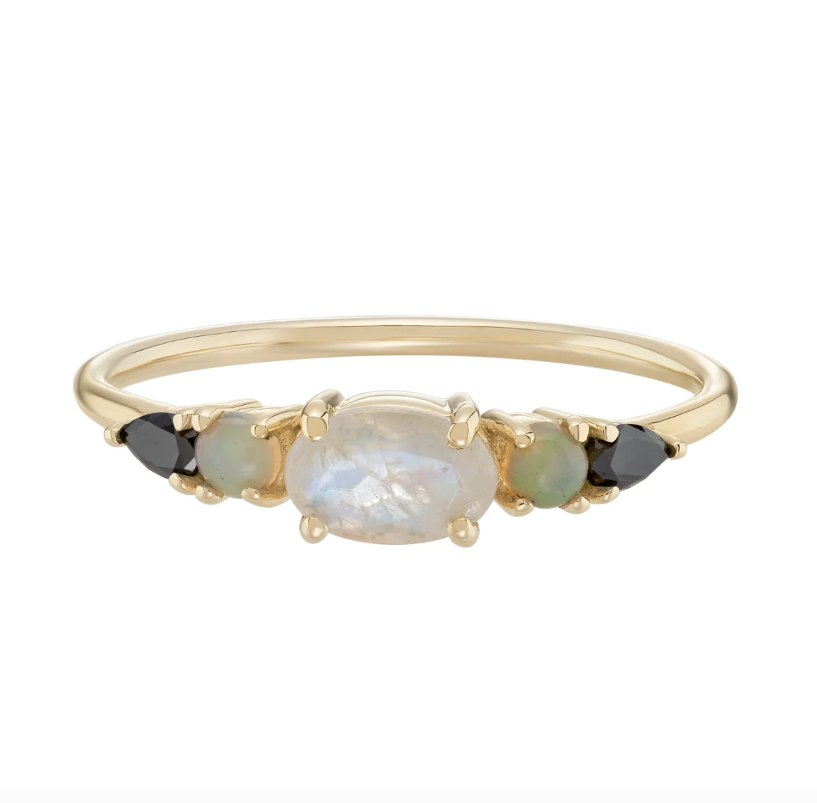 a gold 5 stone ring with moonstone, opal, and black diamonds on a white background