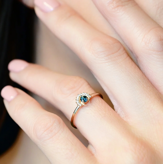close up of a amodel wearing the blue tourmaline tower ring