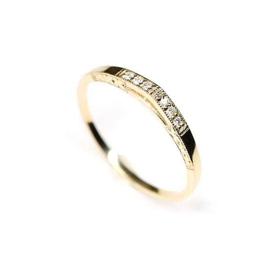 arc white diamond band with hand engraving details on a white background