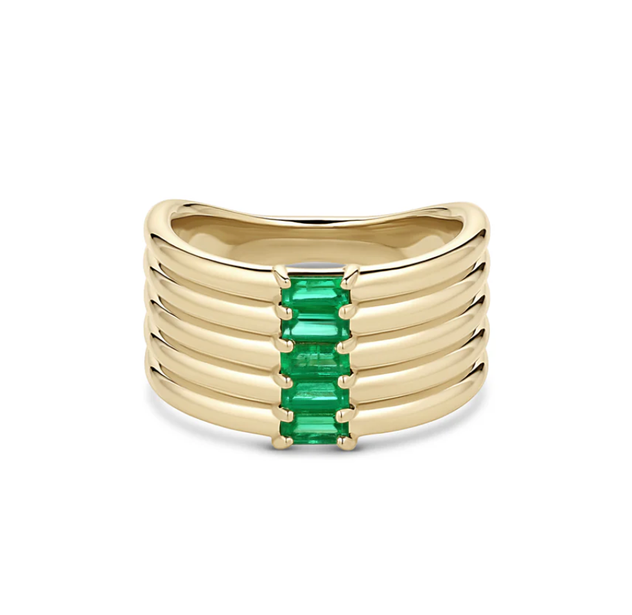 front view of the revival stack baguette ring in gold with emeralds on a white backgroung