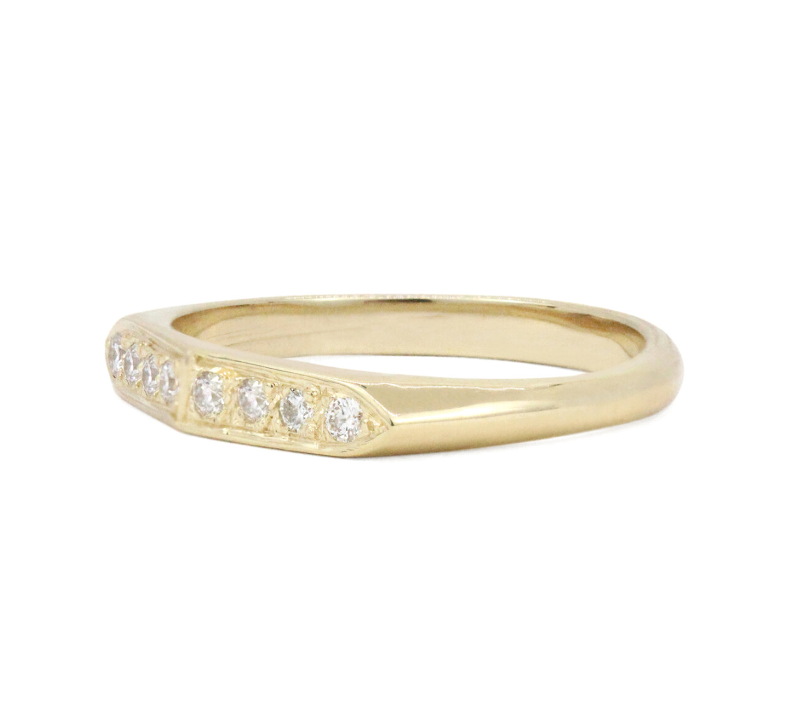 angled view of the gracia white diamond ring on a white background