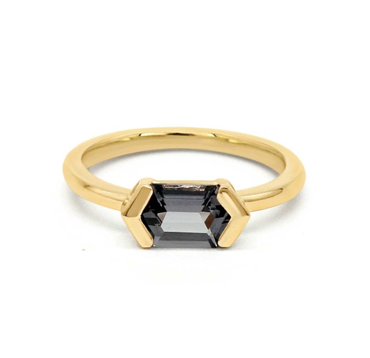 hexagon lavender spinel half bezel set in 14k yellow gold solitaire on a white background