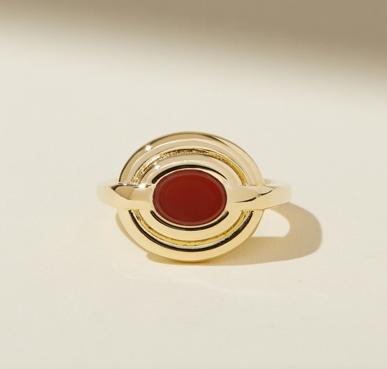 round gold statement ring with oval carnelian center