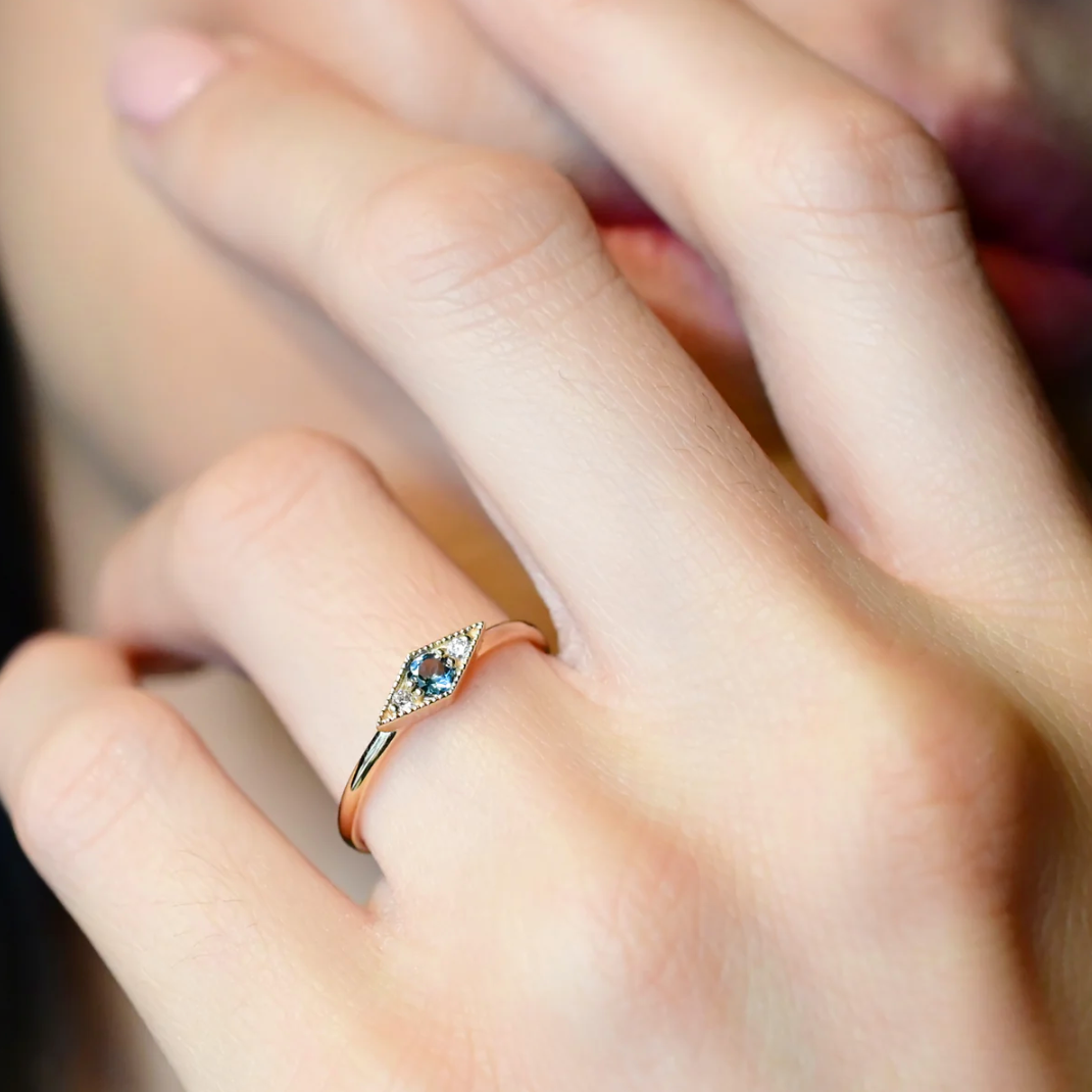 close up of a model wearing the blue tourmaline shillay ring on their ring finger