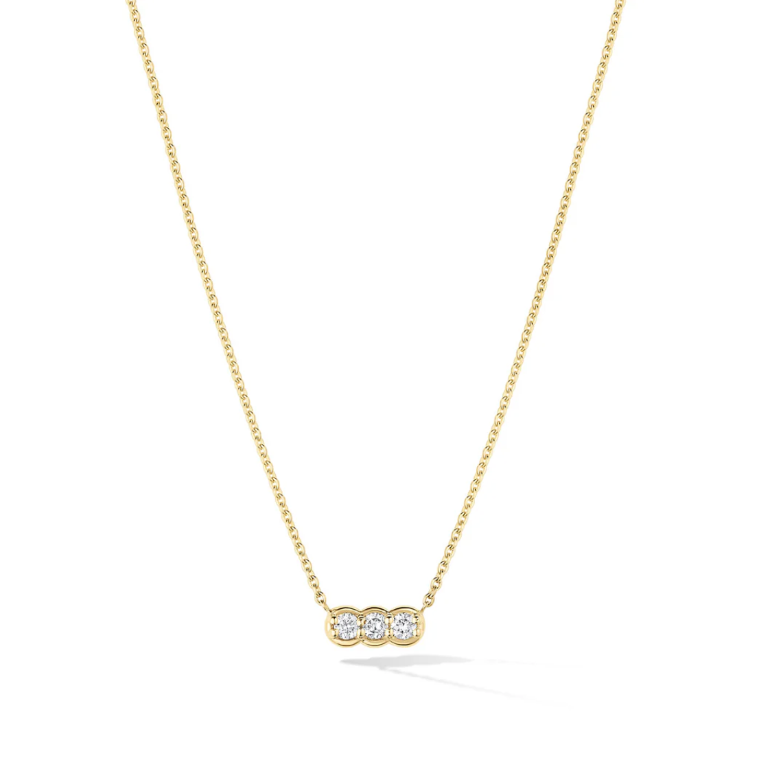 pendant necklace three round diamonds set in 14k yellow gold on a white background