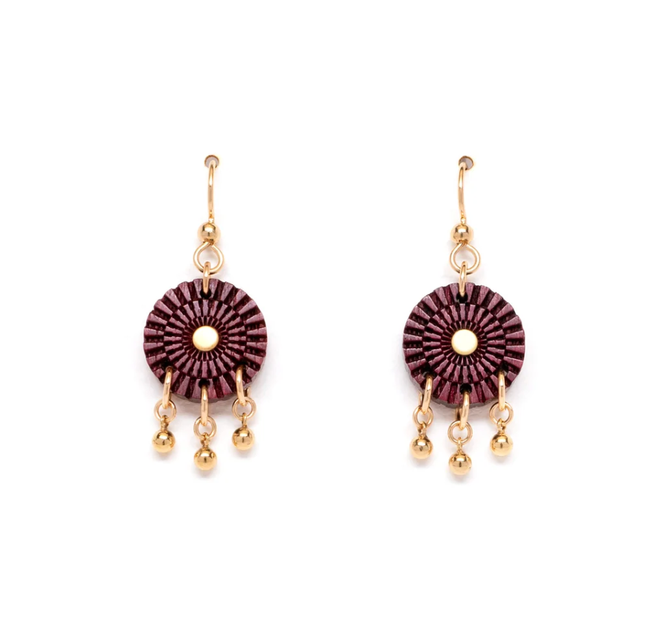 purple geometric designed circle drop earrings with gold dangles on a white background