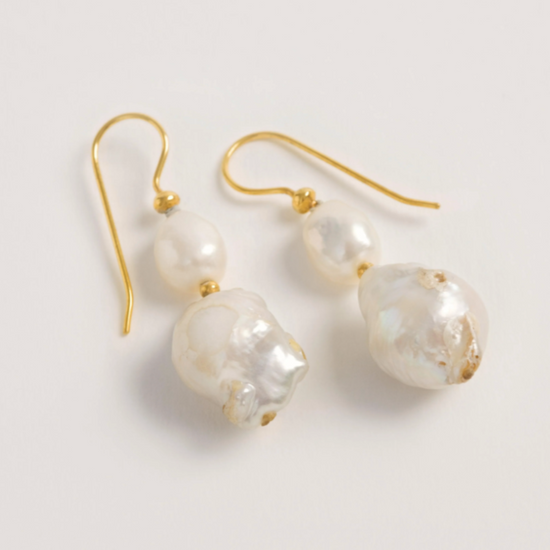 baroque pearl drop earrings on white background