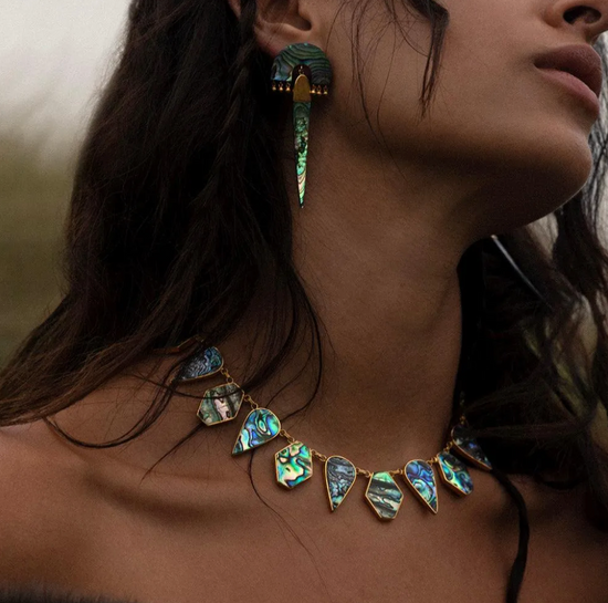 close up of a model wearing the abalone statement necklace