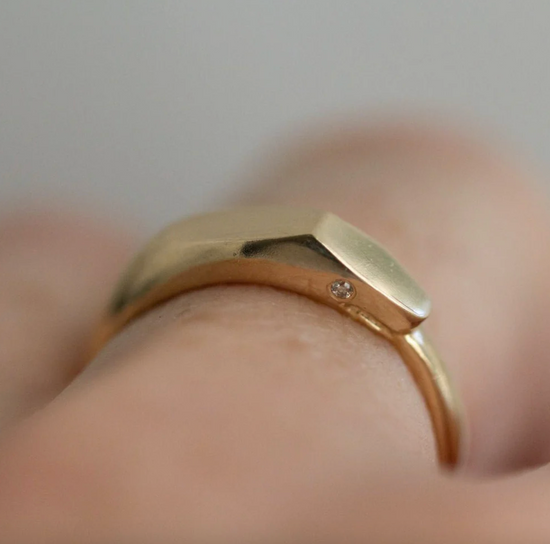 close up of model wearing the ouroboros ring with white diamond eyes