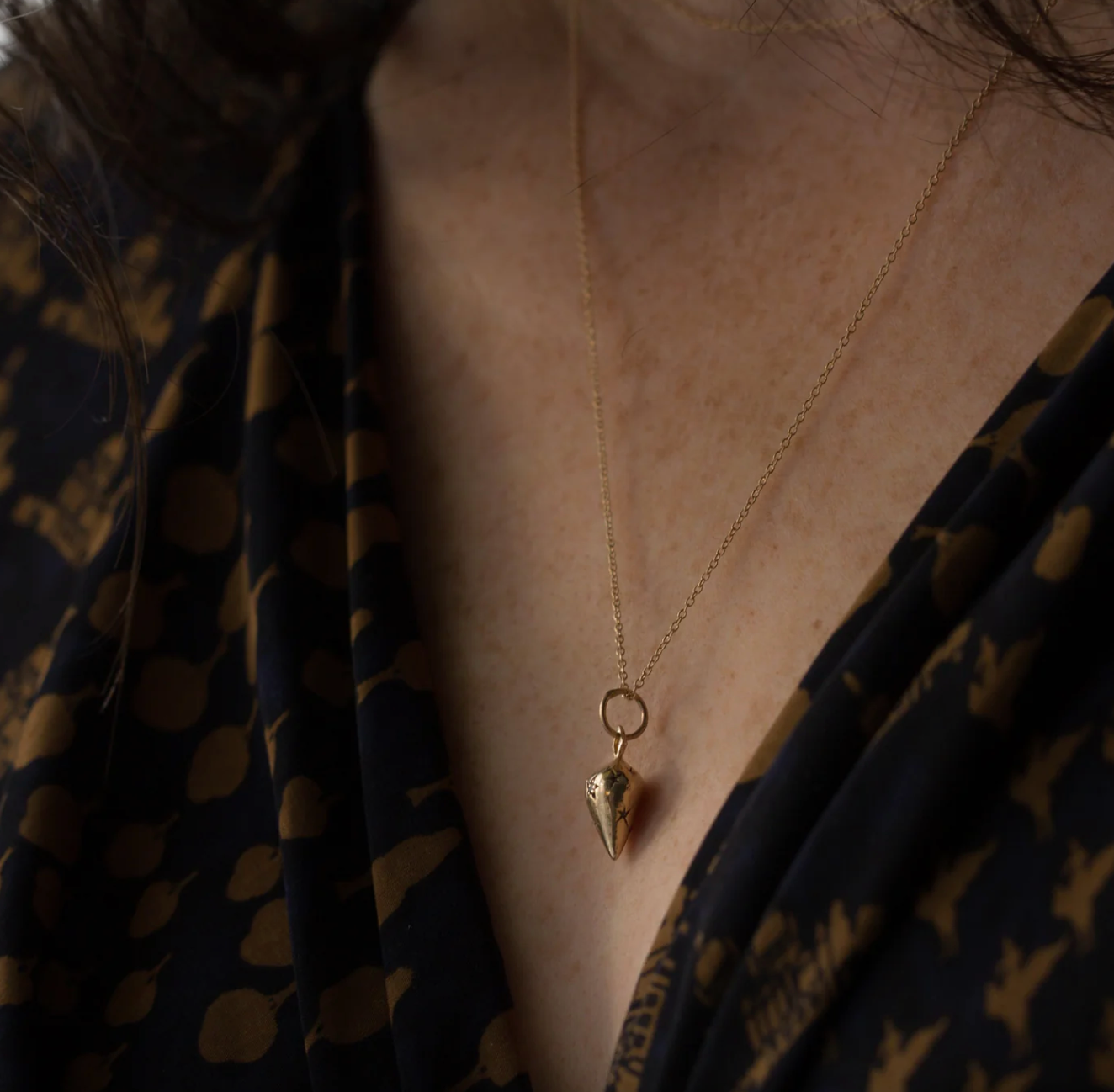 model wearing the pendulum talisman 