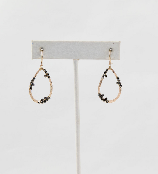 cluster bead drop earrings on white earring stand on white background