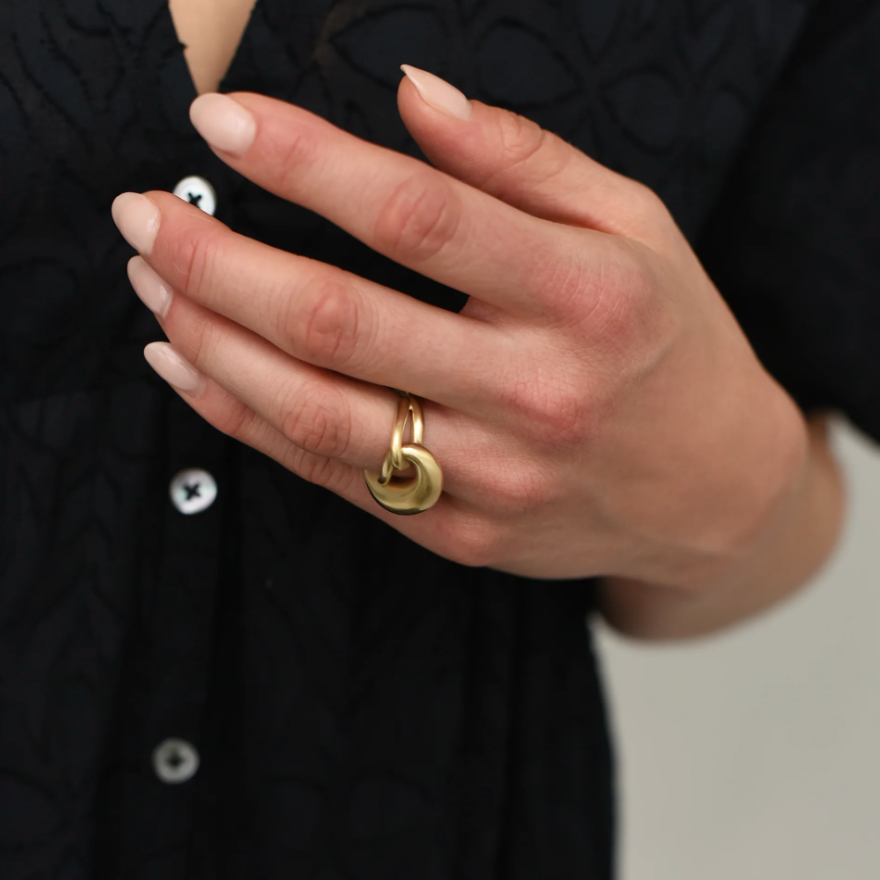 close up of model wearing the brass cloud ring on ring finger