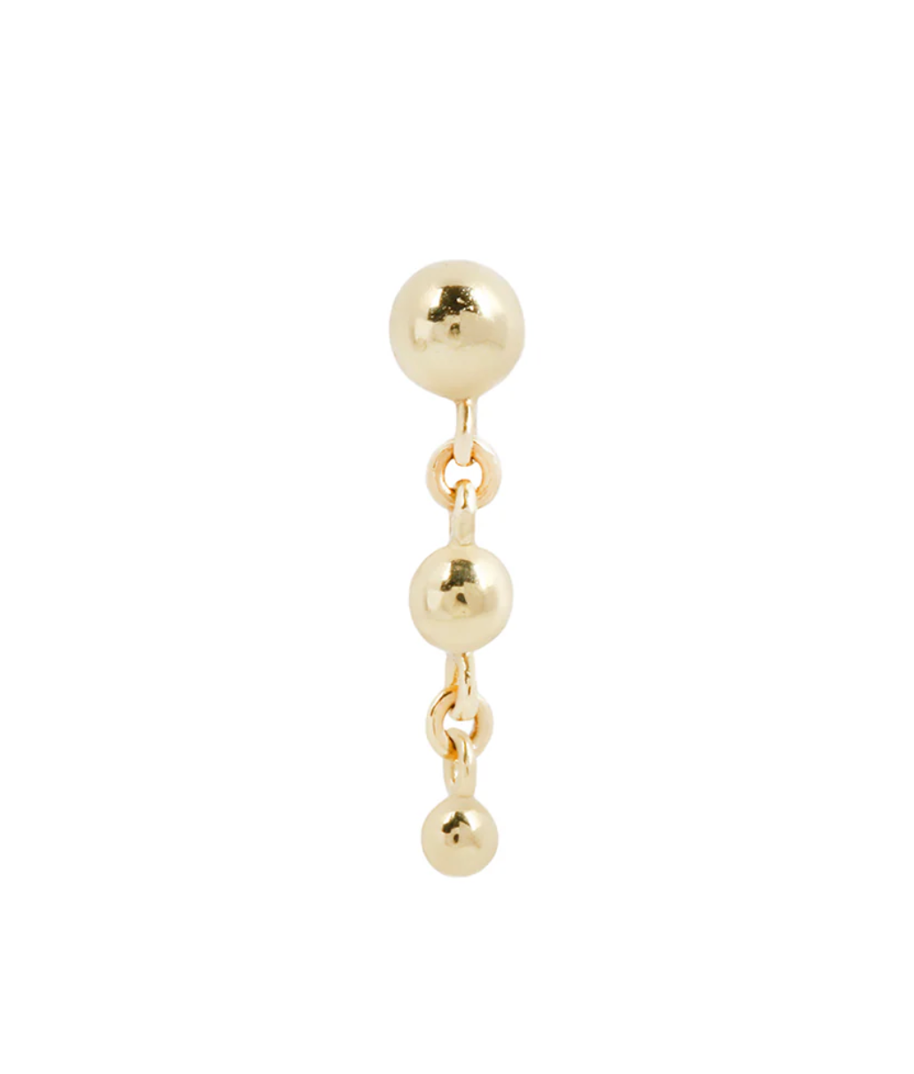 gold dangle stud earring on a white background
