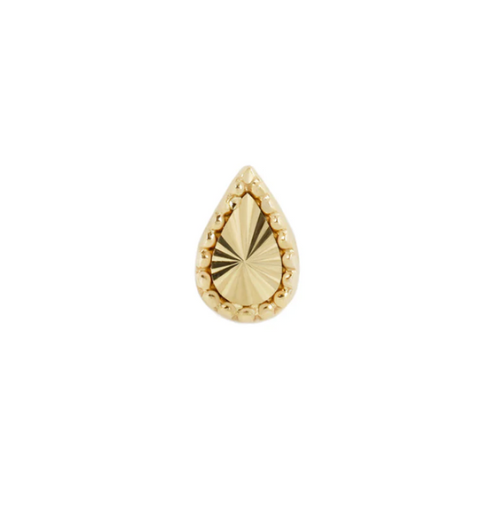 pear shaped gold stud with textured details on a white background