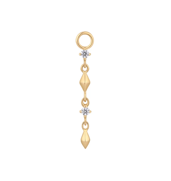 gold earring charm with two pyramid shaped gold dangles with two round crystals in between on a white background