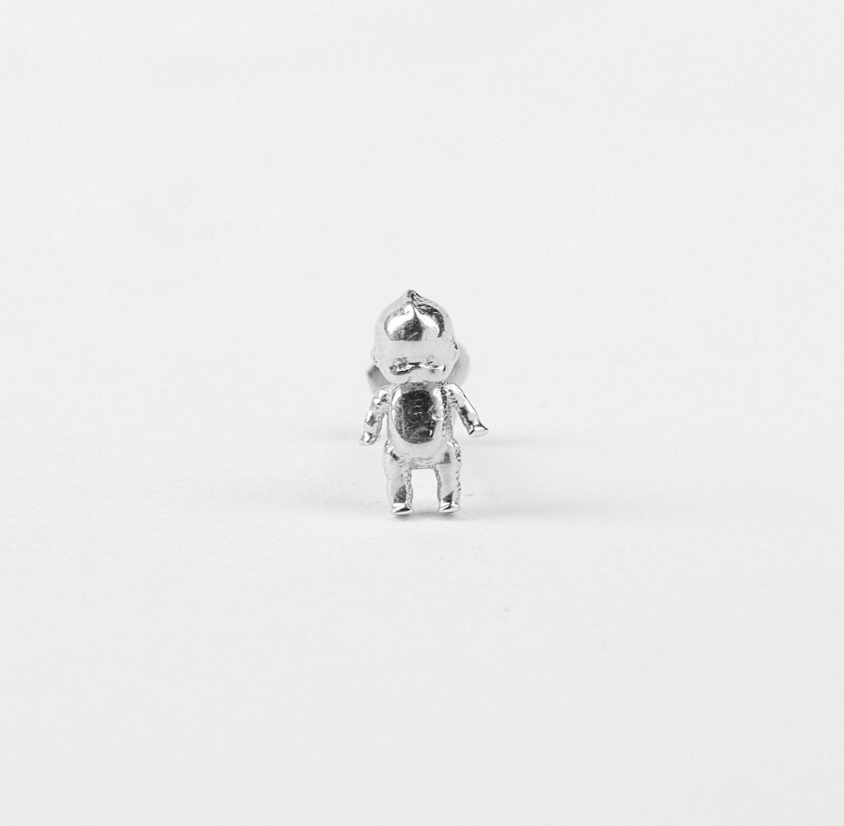 single silver kewpie baby stud earring on white background