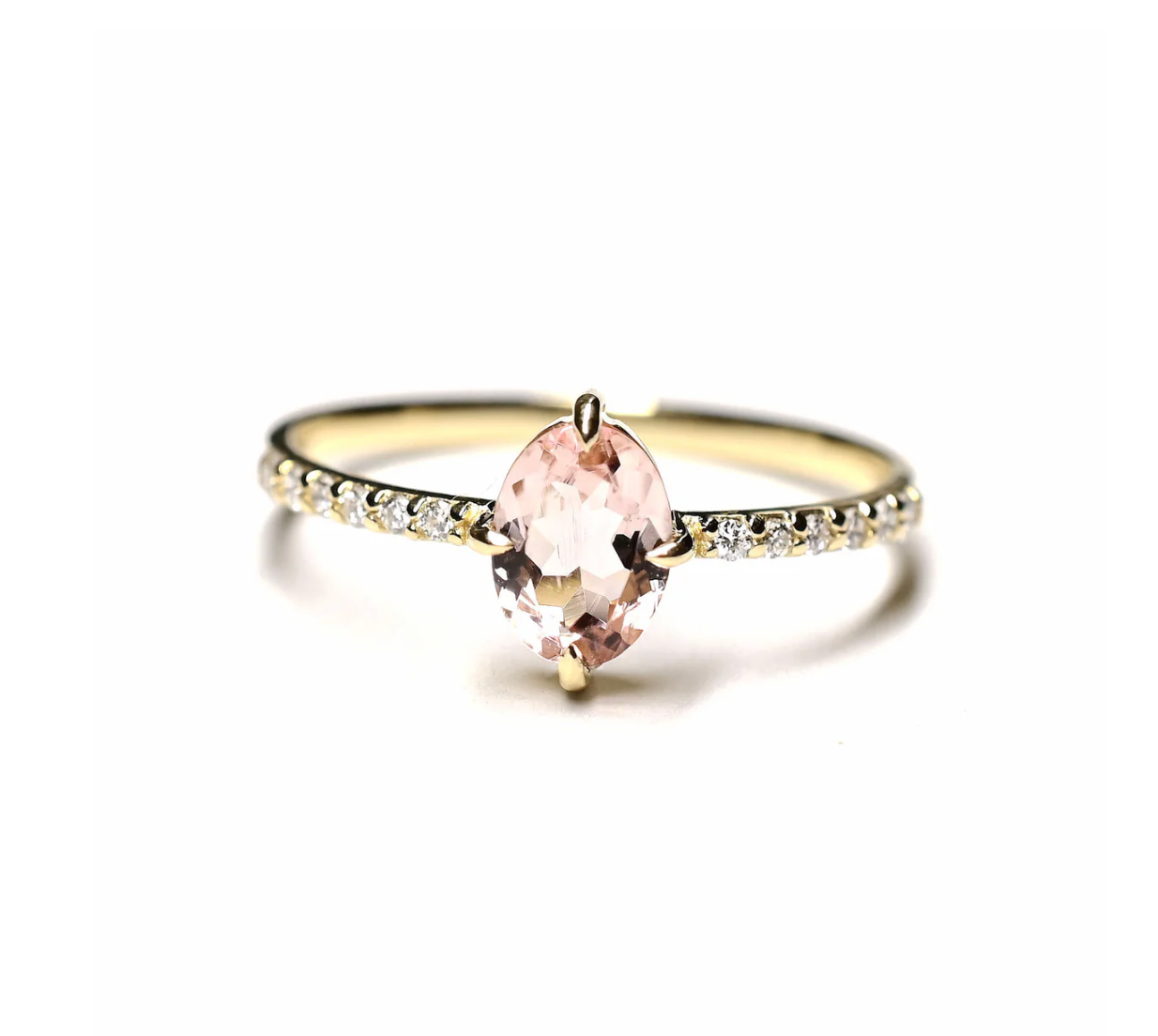 OVAL PINK TOURMALINE SOLITAIRE WITH WHITE DIAMOND PAVE BAND ON WHITE BACKGROUND