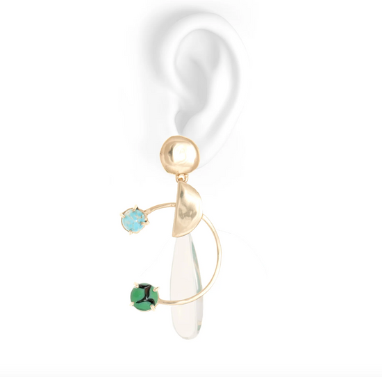 the bowie earrings on a fake white ear