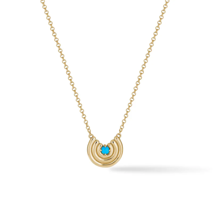 Gold necklace with a half-circle pendant featuring a turquoise gemstone on a white background