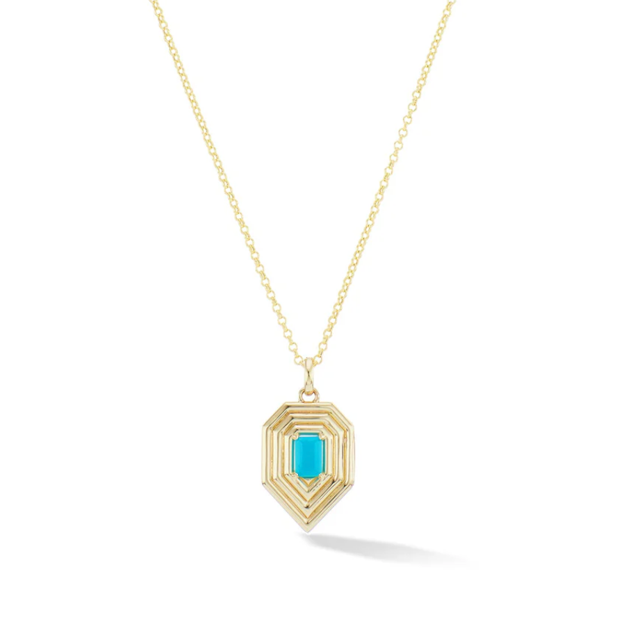 Gold necklace with a hexagonal pendant featuring a turquoise gemstone on a white background