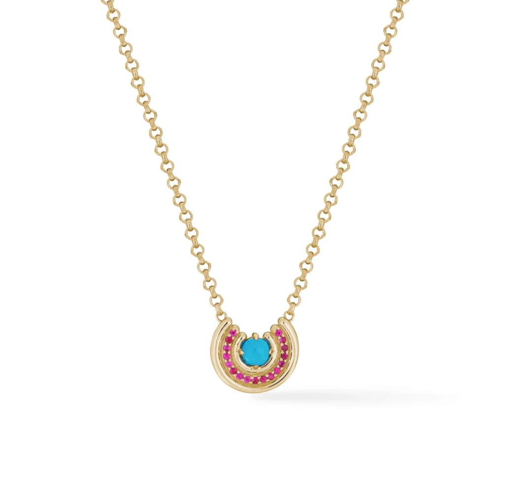 Gold necklace with a turquoise gemstone surrounded by pink sapphires pendant on a white background